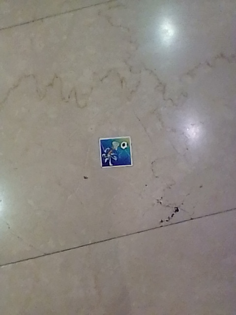 Squidward sticker sticked to the mall's floor tiles. Still wondering how old it is, if it ever survived the Cleaner.